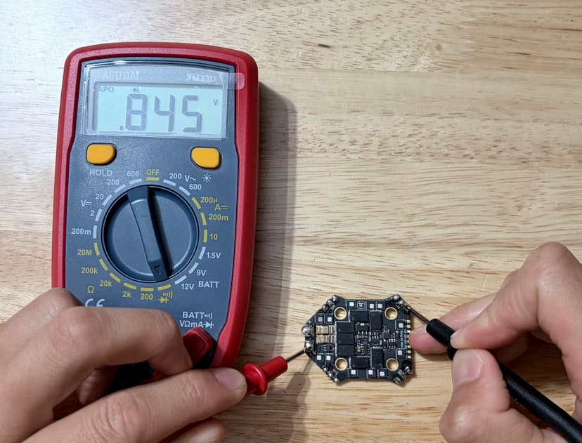 Low-side test on phase B. Multimeter reads 0.845 V.